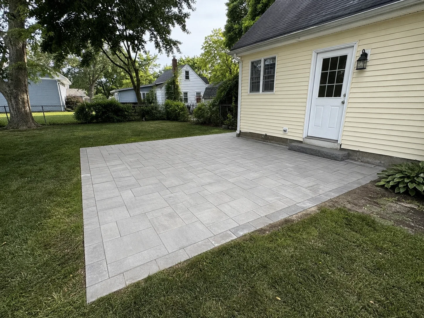 Paver installation Elyria Ohio Lorain County residential patio Lake Erie freeze-thaw Derek